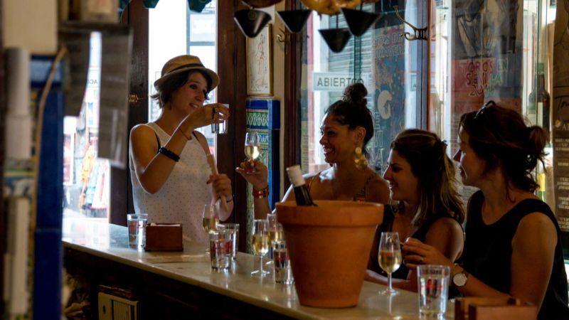 Four women at a bar in Spain