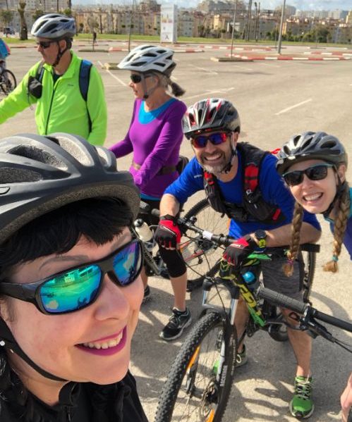 A selfie of five cyclists