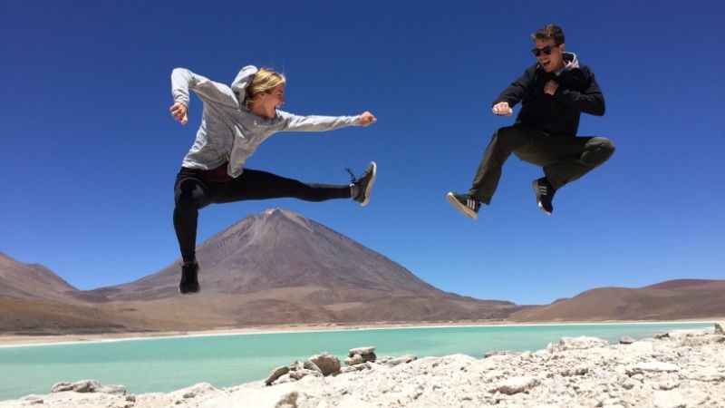 A couple jumping in the air in Bolivia