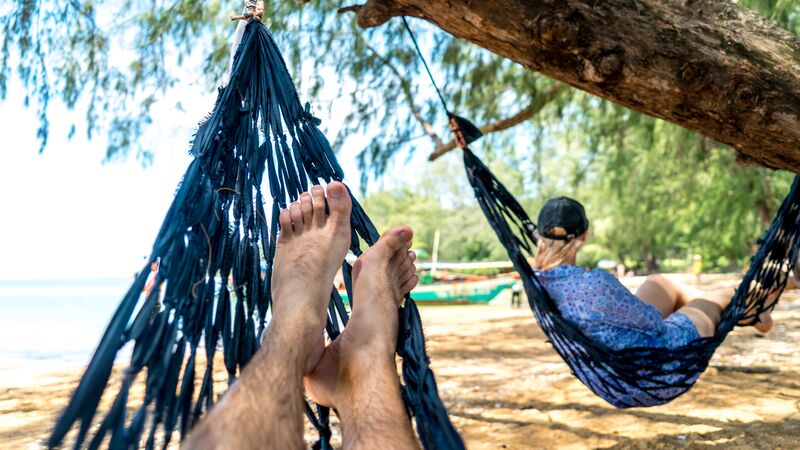 Two people relaxing in a hammock. 