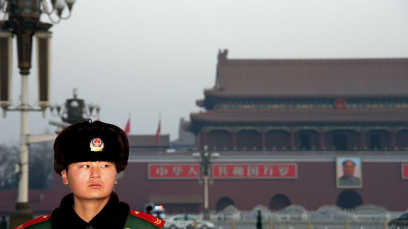 A guard in China giving the camera a sideways glance