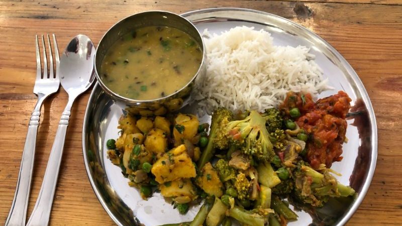 A plate of dal bhat, rice and broccoli in Nepal