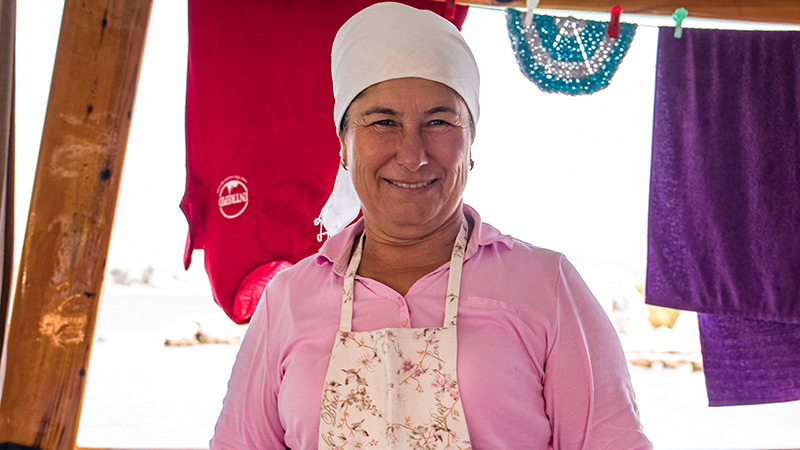 A smiling Turkish woman on board a boat