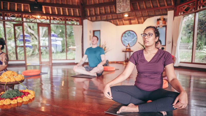 People in a yoga class in Bali