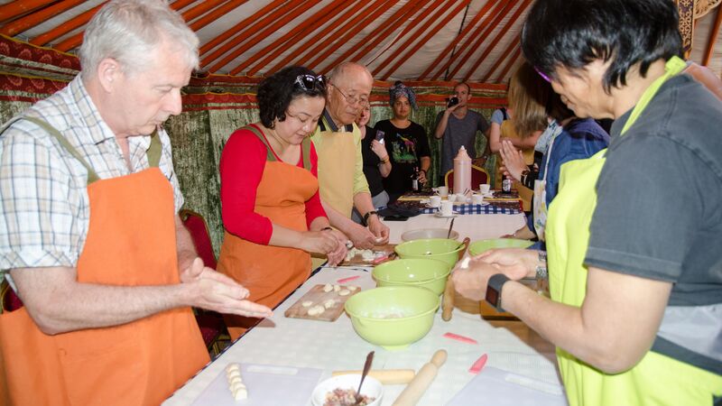 Travellers at a cooking class in Mongolia