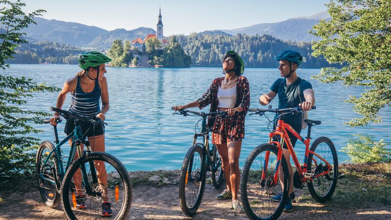 Three cyclists at Lake Bled, Slovenia