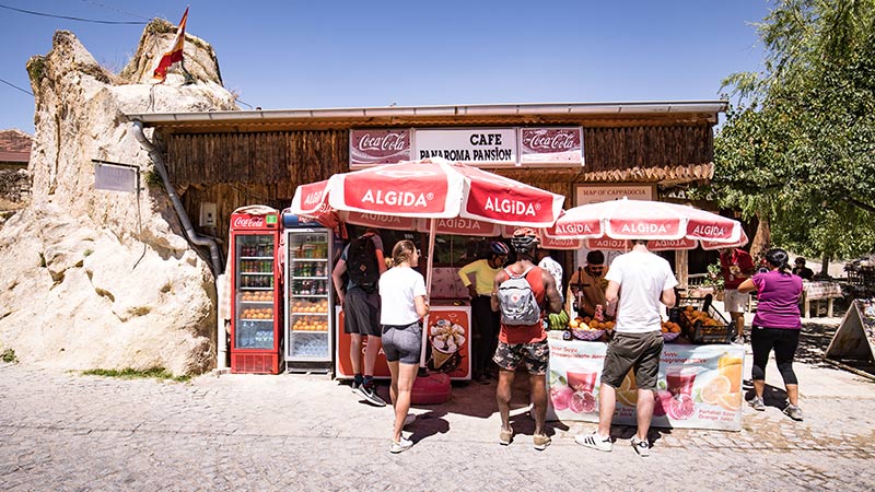 Travellers stocking up on cool drinks at a small shop in Turkey