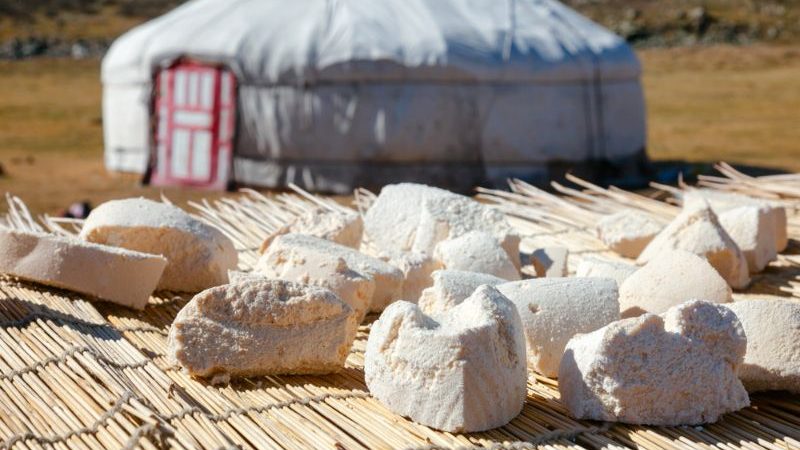 Dried cheese on a table outside a tent in Mongolia