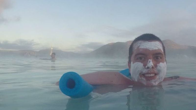 a man floating in the Blue Lagoon in Iceland