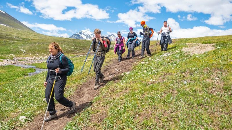 Trekkers on their way through a valley