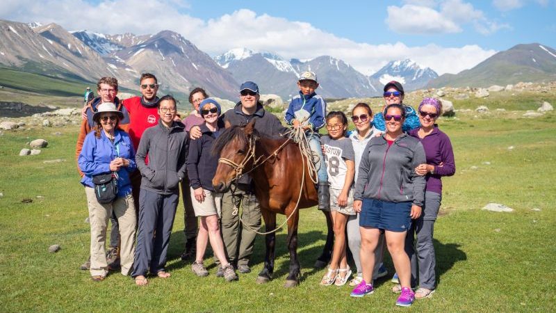 A tour group with a local family in Mongolia
