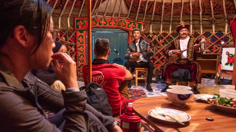 Musicians playing traditional instruments in a ger