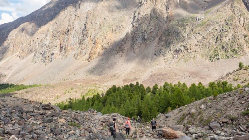 Hikers making their way up a mountain in Russia