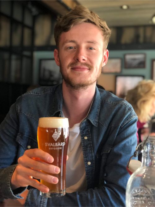 A man drinking a beer in Longyearbyen