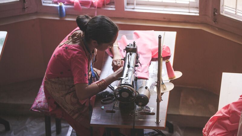 A woman sewing at Seven Women in Kathmandu