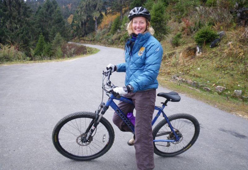 A woman on a mountain bike in Bhutan.