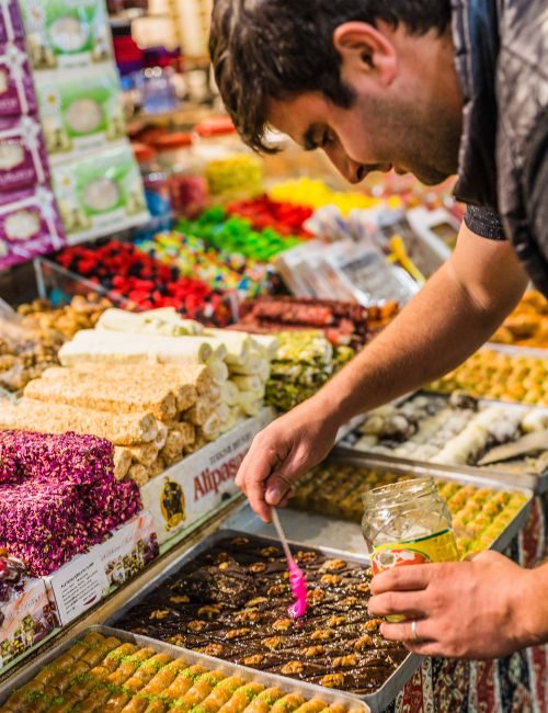 A man selling sweets in the market