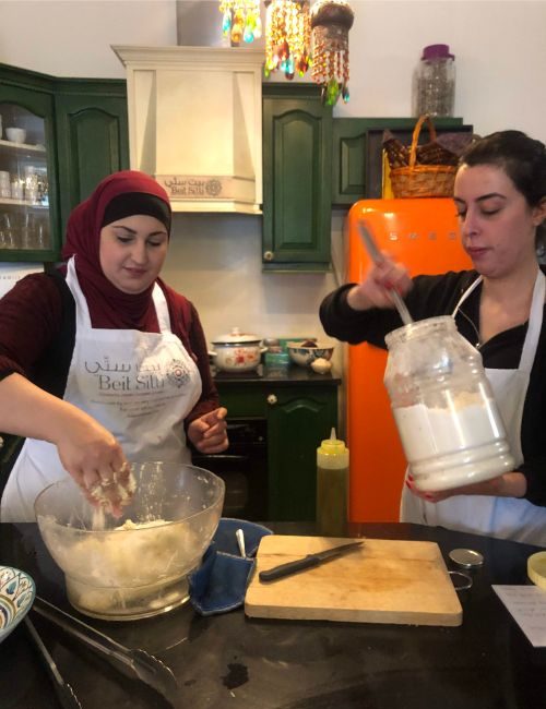 Two women in a kitchen.