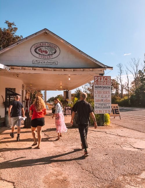 A group of travellers at an old gas station in the USA