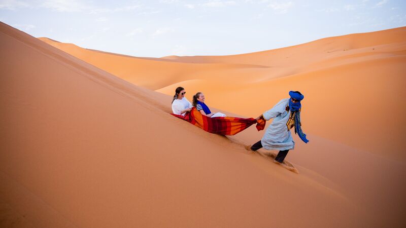 Two travellers and a Berber in Morocco