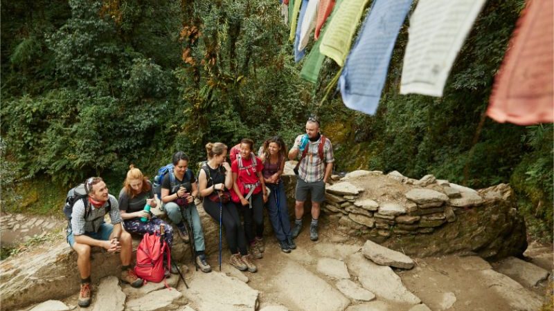 A group of trekkers stop for a drink on the Annapurna Base Camp trail