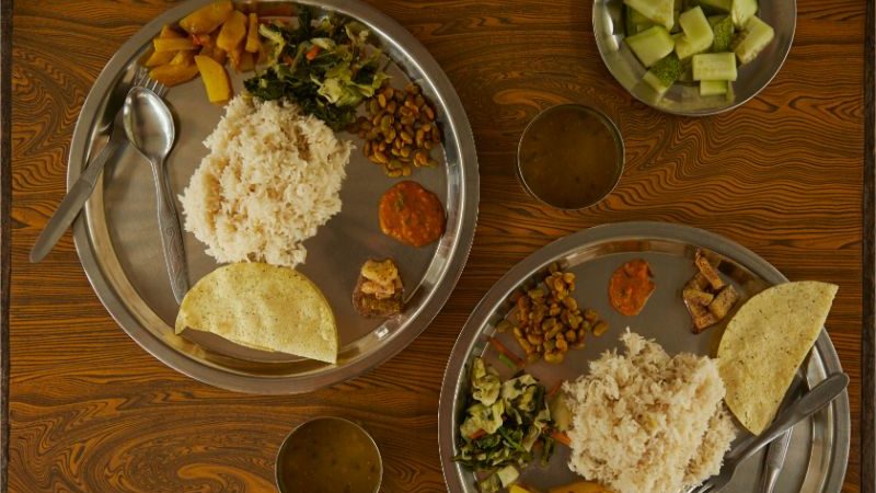 Two plates on dal bhat in Nepal.