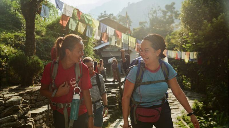 A hiker and her trekking guide in Nepal