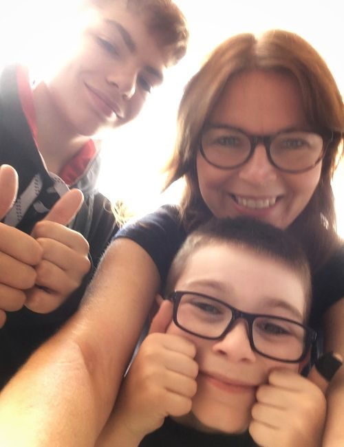 A selfie of a mum with her two young sons