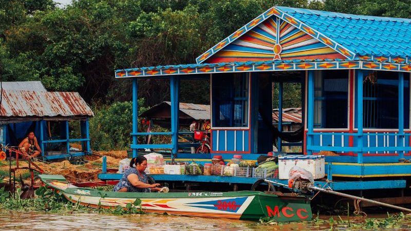 A colourful house and canoe in Cambodia