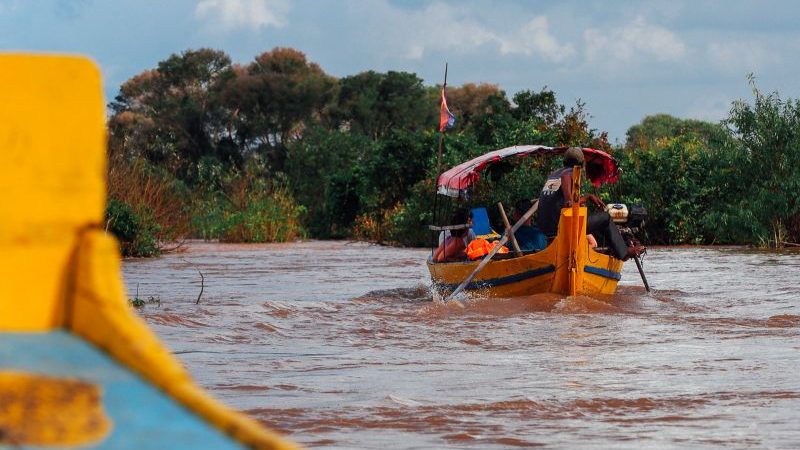 Two motorboats on the river in Cambodia