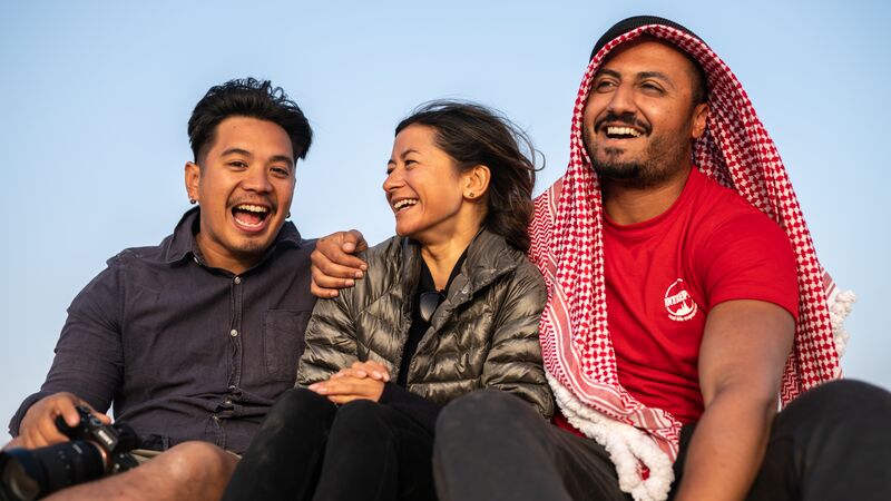 Three travellers in Wadi Rum, Jordan.