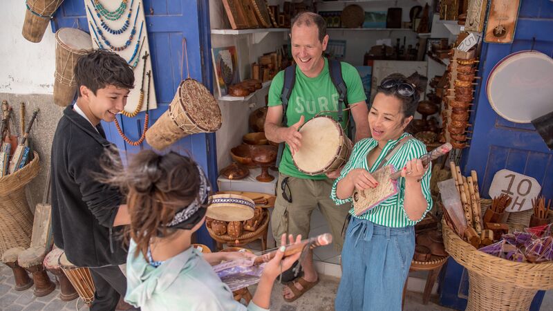 A family playing musical instruments in Morocco