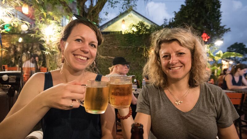 Two women enjoying a beer in Vietnam