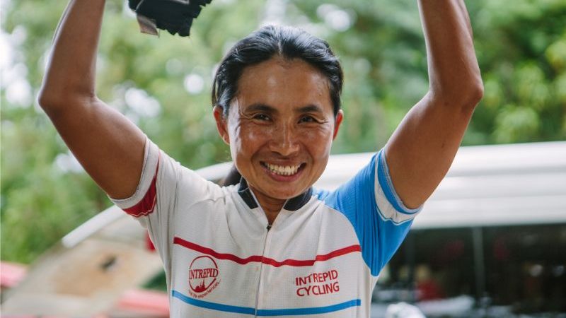 A woman wearing a cycling jersey in Cambodia