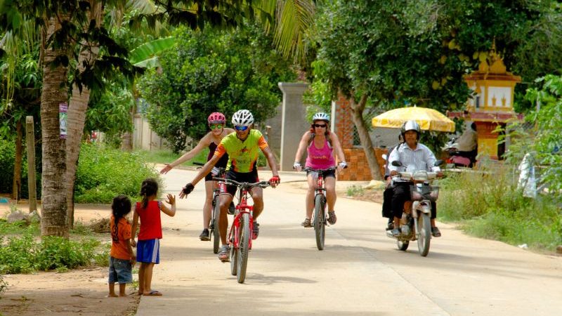 A tour group cycling through Cambodia