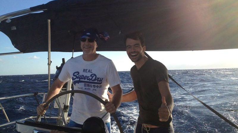 Two men skippering a yacht