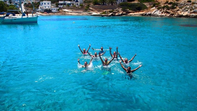 Swimmers in a beautiful cove in Greece