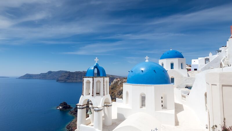 Blue-domed churches in Santorini in the Greek Islands