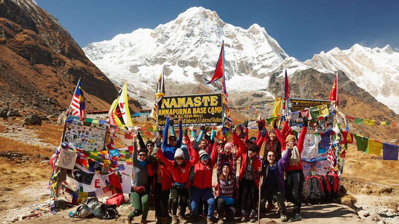 A group of trekkers and porters at Annapurna Base Camp, Nepal