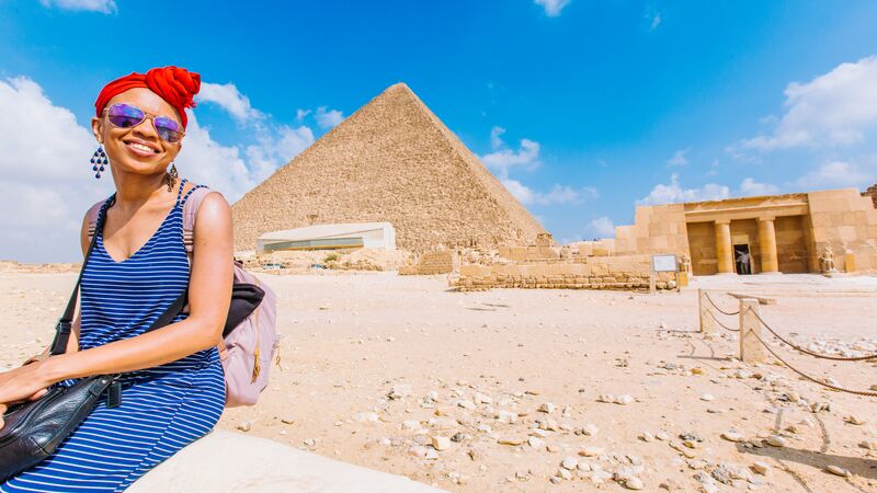 Traveller in front of the Pyramids