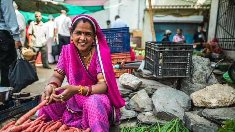 A local vendor at a market in Udaipur, India 