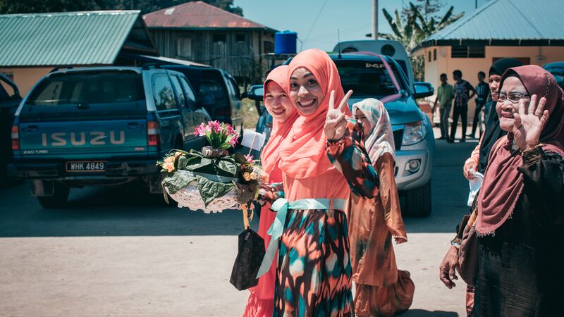Happy women waving.