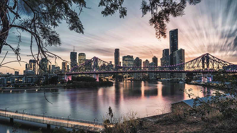 A view of the setting sun against the city from Wilson Outlook in Brisbane.