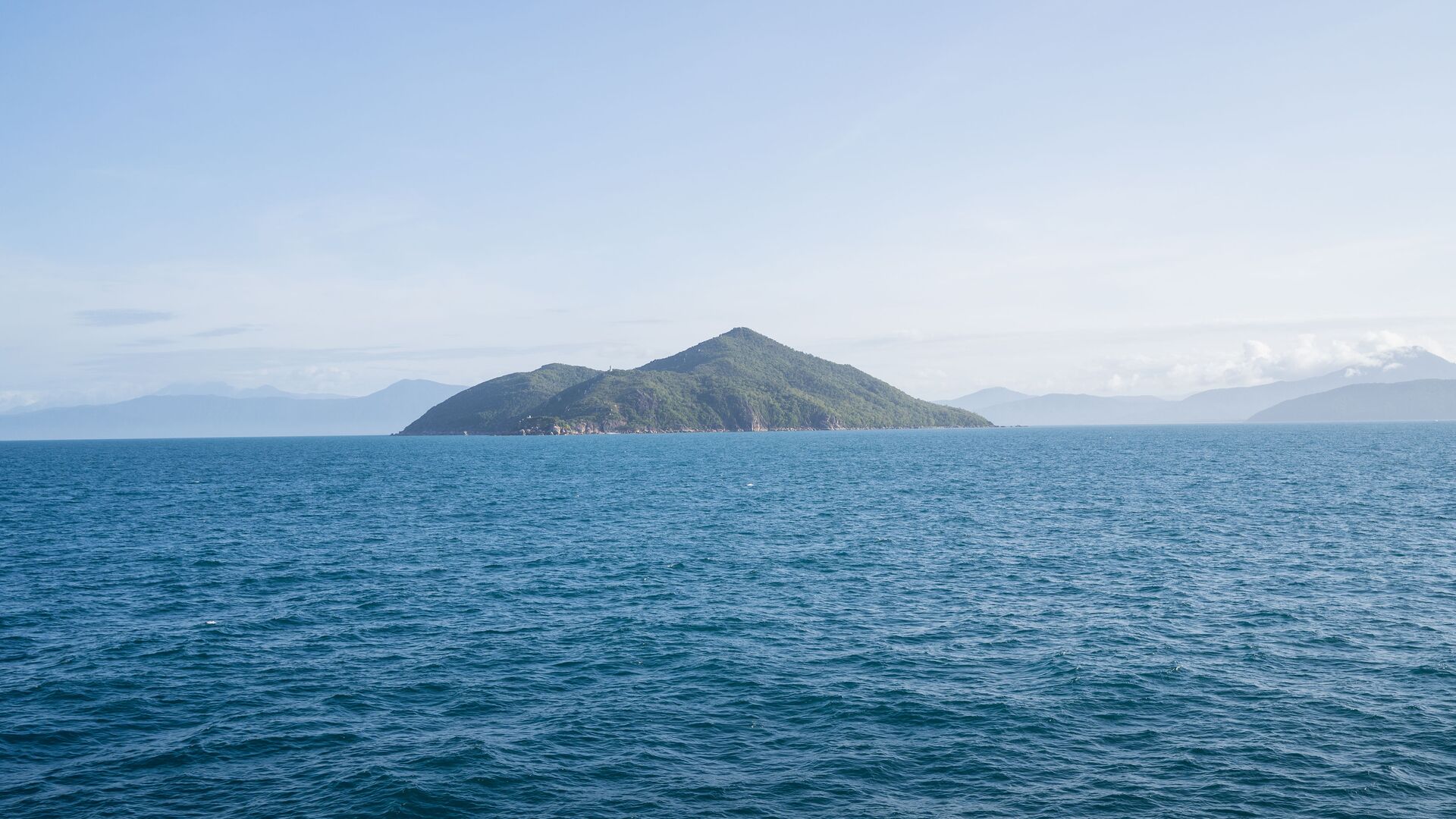 Fitzroy Island rises from the waters of Queensland as seen from a trip to the Great Barrier Reef.