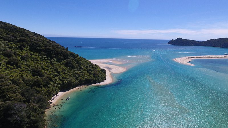 The sparkling blue waters of Awaroa Inlet, Abel Tasman.