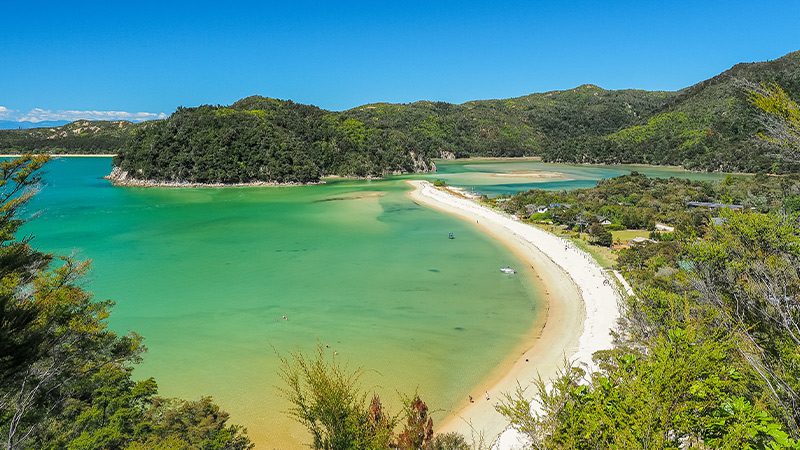 Aerial view of the clear waters of Torrent Bay in Abel Tasman, New Zealand.