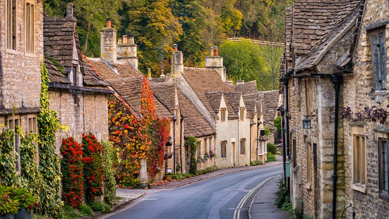 A street lined with stone cottages in the Cotswolds