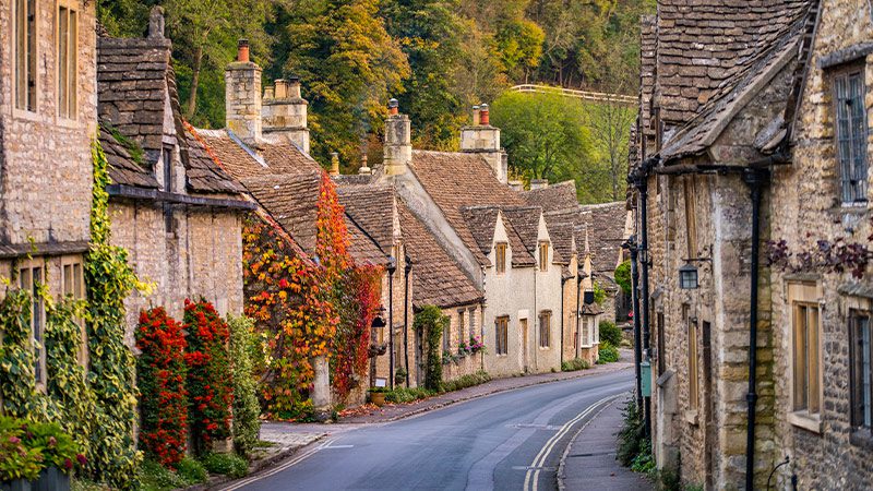 A street lined with stone cottages in the Cotswolds