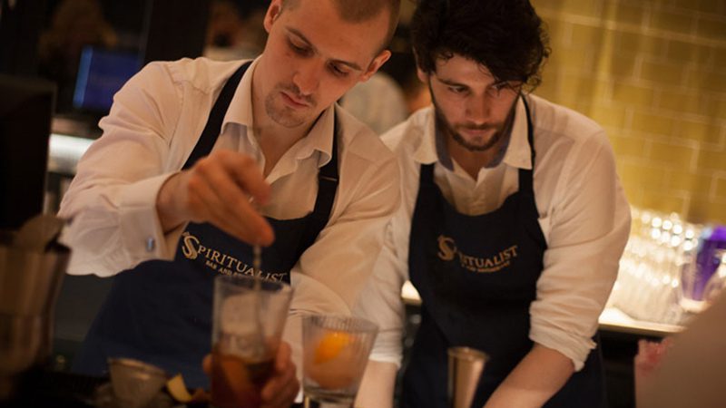 Two bar staff making cocktails at The Spiritualist in Glasgow.