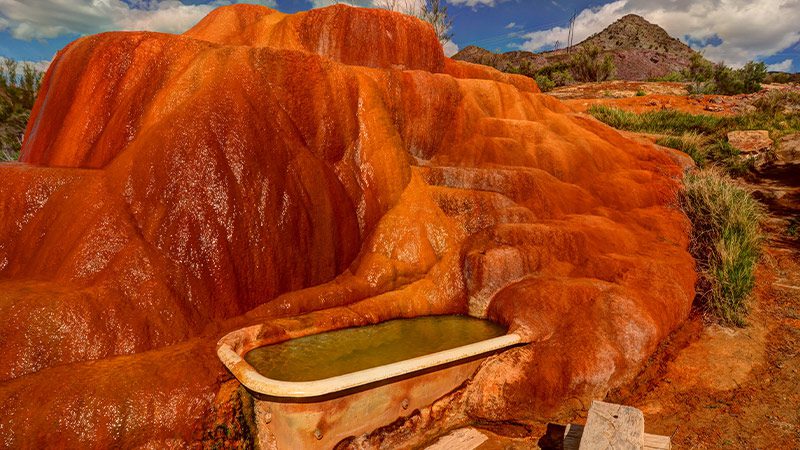 A bathtub in the red rock of Mystic Hot Springs in Utah.